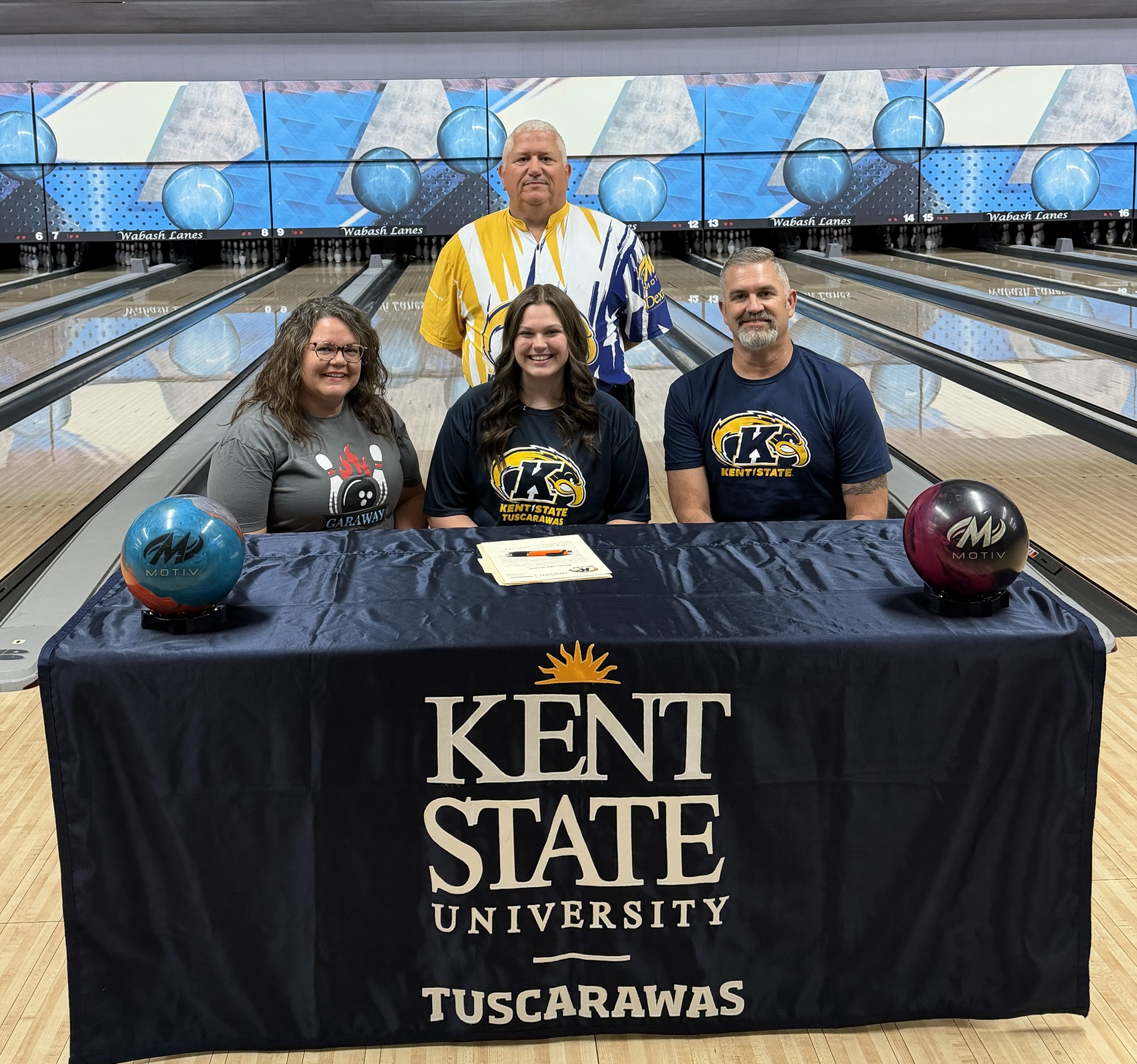 Picture from left to right picture 1: Mother, Heidi Fortney, Ava Starner, Father, Josh Starner. Standing: Coach Beckley